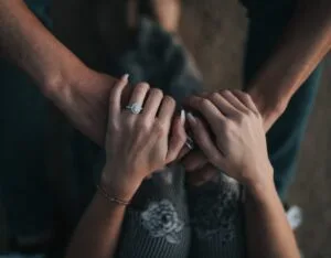man and woman holding each others hands
